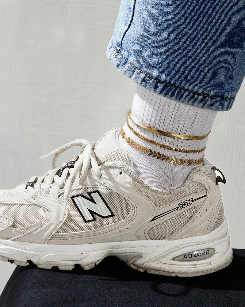 Close-up of the Fishbone, 3mm Cuban, and Snake chains on the Layering Anklet Bracelet Set